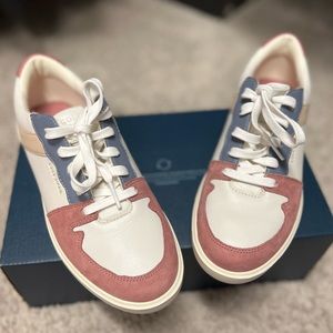 Cole Haan “Grand Crosscourt Modern Tennis Sneakers”.